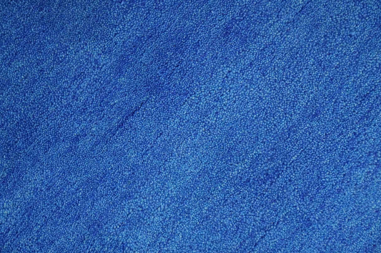Custom made solid Blue Woolen Hand Tufted contemporary area Rug