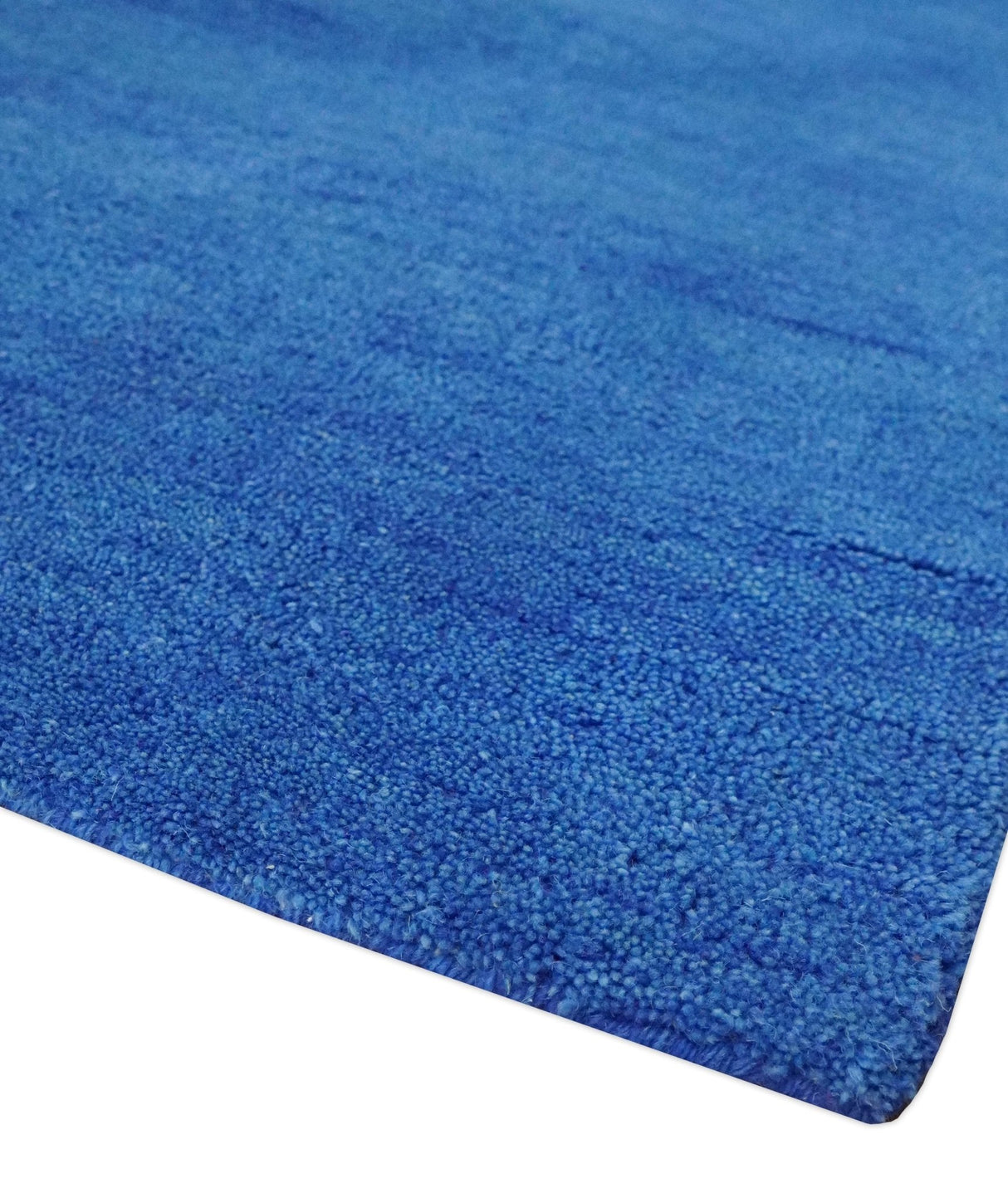 Custom made solid Blue Woolen Hand Tufted contemporary area Rug