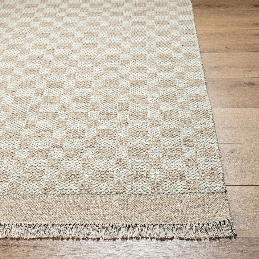 Clinten Solid and Border Tan Area Rug