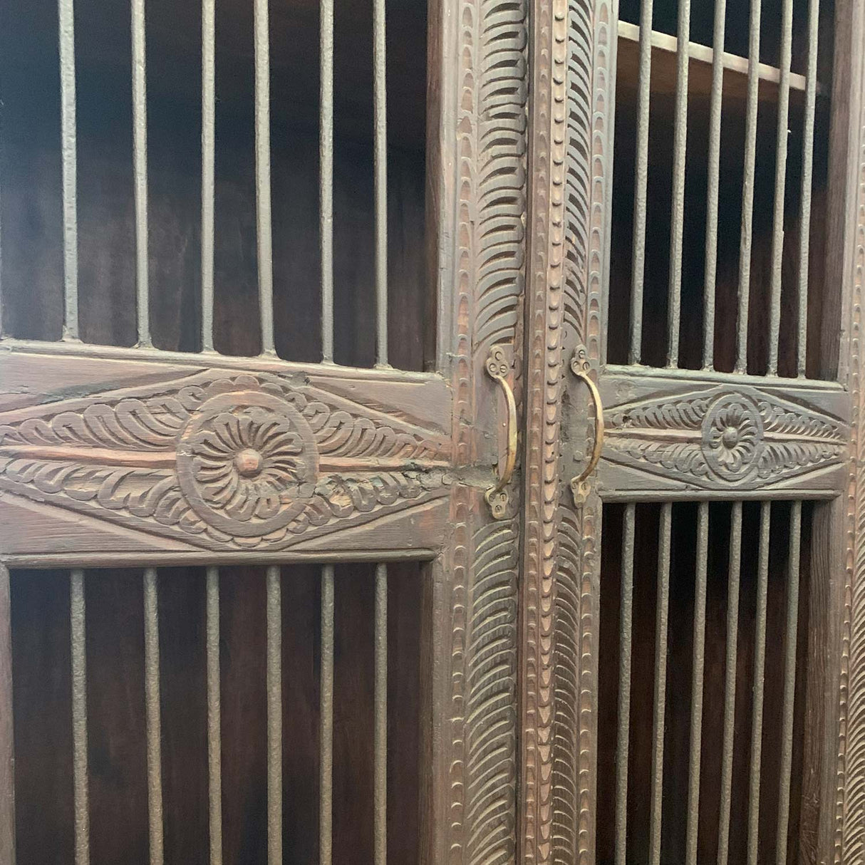 Ornately Hand Carved 45 in. Wide Armoire With Iron Grill Doors