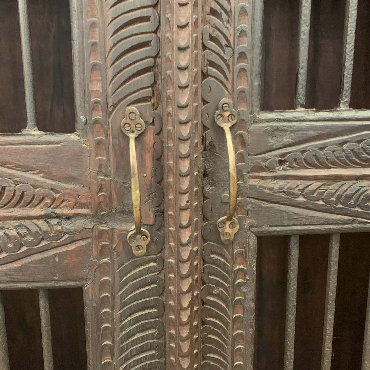 Ornately Hand Carved 45 in. Wide Armoire With Iron Grill Doors