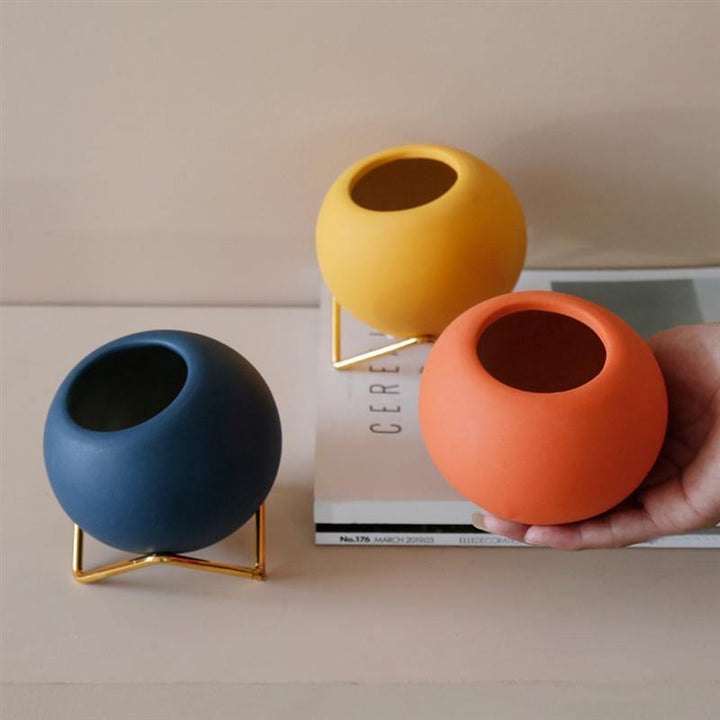 Macetas de cerámica de colores abstractos con soporte